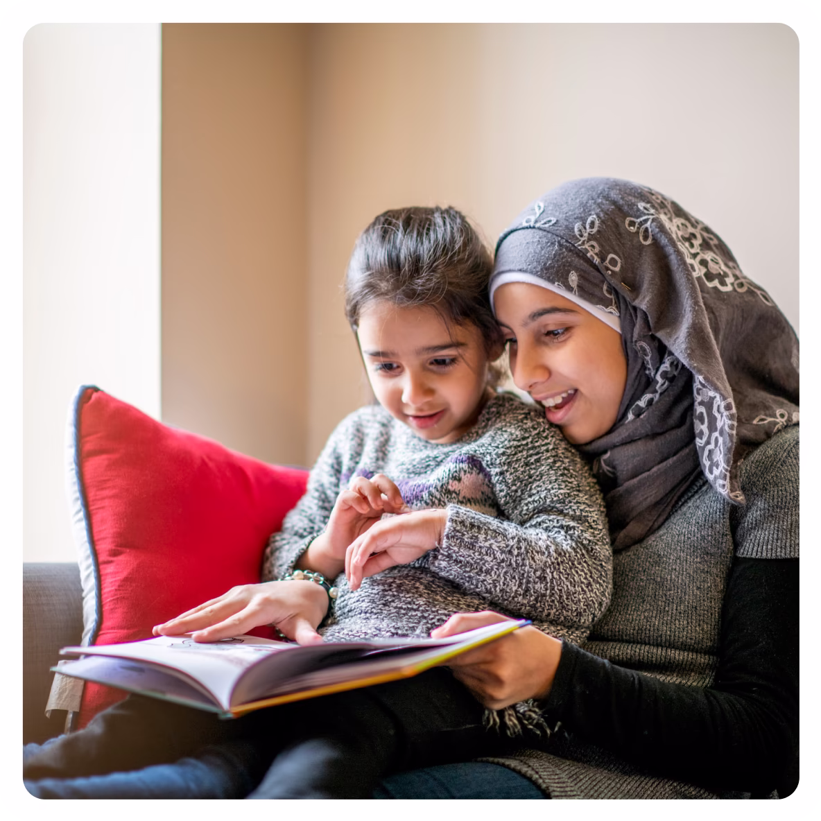 a muslin female read books for her child